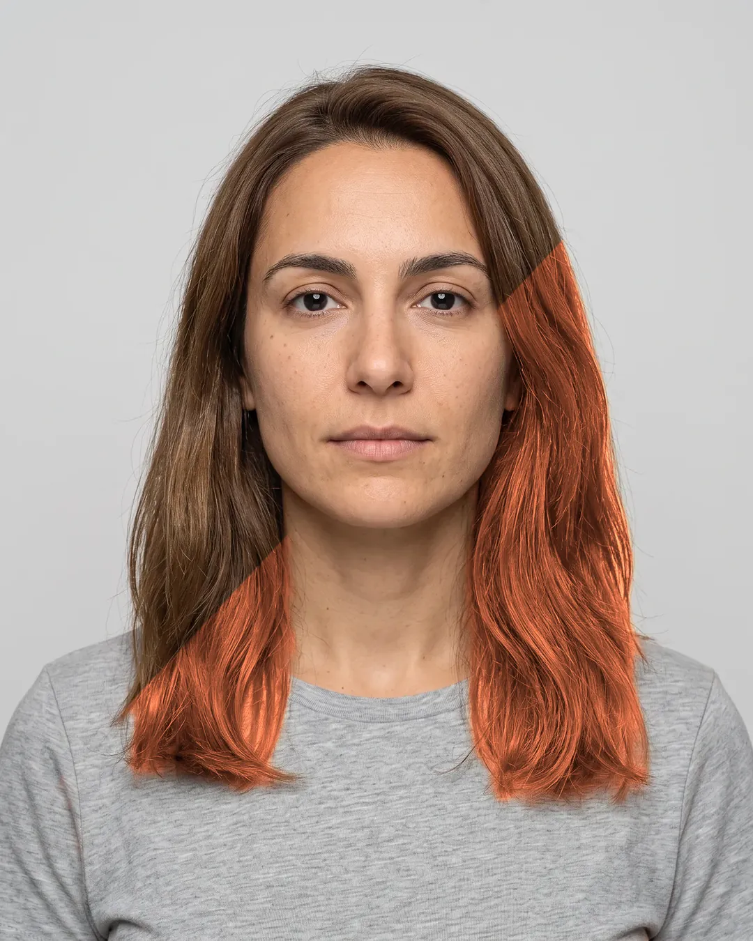AI-generated portrait of a woman with shoulder-length brown hair. Beyond a diagonal line her hair is digitally recoloured in the shade Copper Sunset.